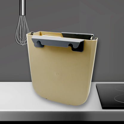 Wukusy small collapsible hanging trash can for kitchen cabinet door, suitable for bathroom, bedroom, office, or car.