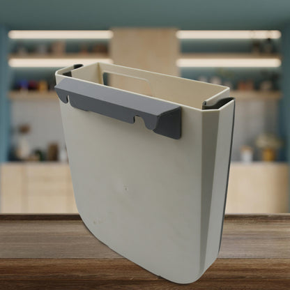 Wukusy small foldable hanging trash can for kitchen cabinet door, suitable for bathroom, bedroom, office, or car use.