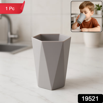Small hexagon-shaped plastic drinking glass by Wukusy, ideal for home and kitchen use. Clear, lightweight, and durable.