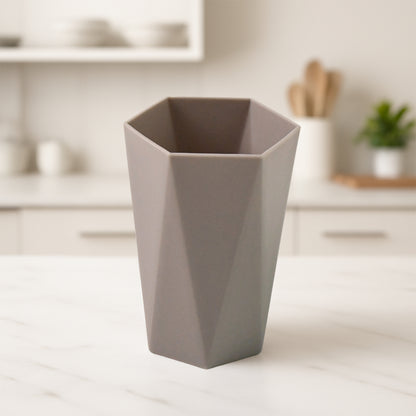 Wukusy hexagon-shaped small plastic drinking glass for home use, clear and lightweight, perfect for beverages.