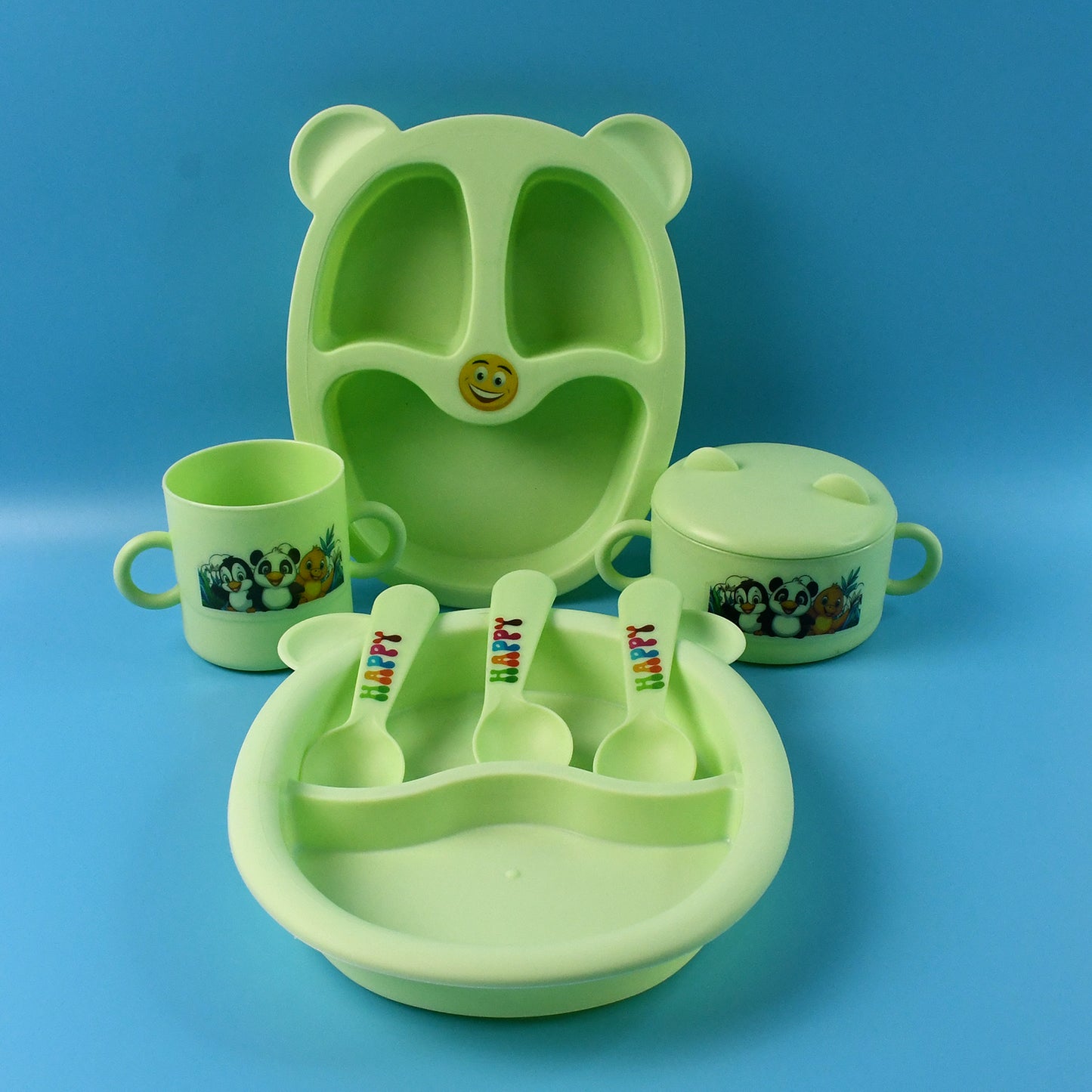 Wukusy Kids Feeding Dinner 8-piece set with colorful plates, bowls, and utensils for children’s mealtime in a home kitchen setting.