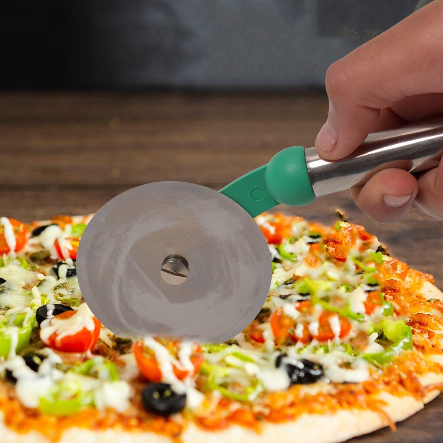 Wukusy stainless steel wheel pizza cutter for home kitchen use, featuring a durable handle and sharp cutting wheel.