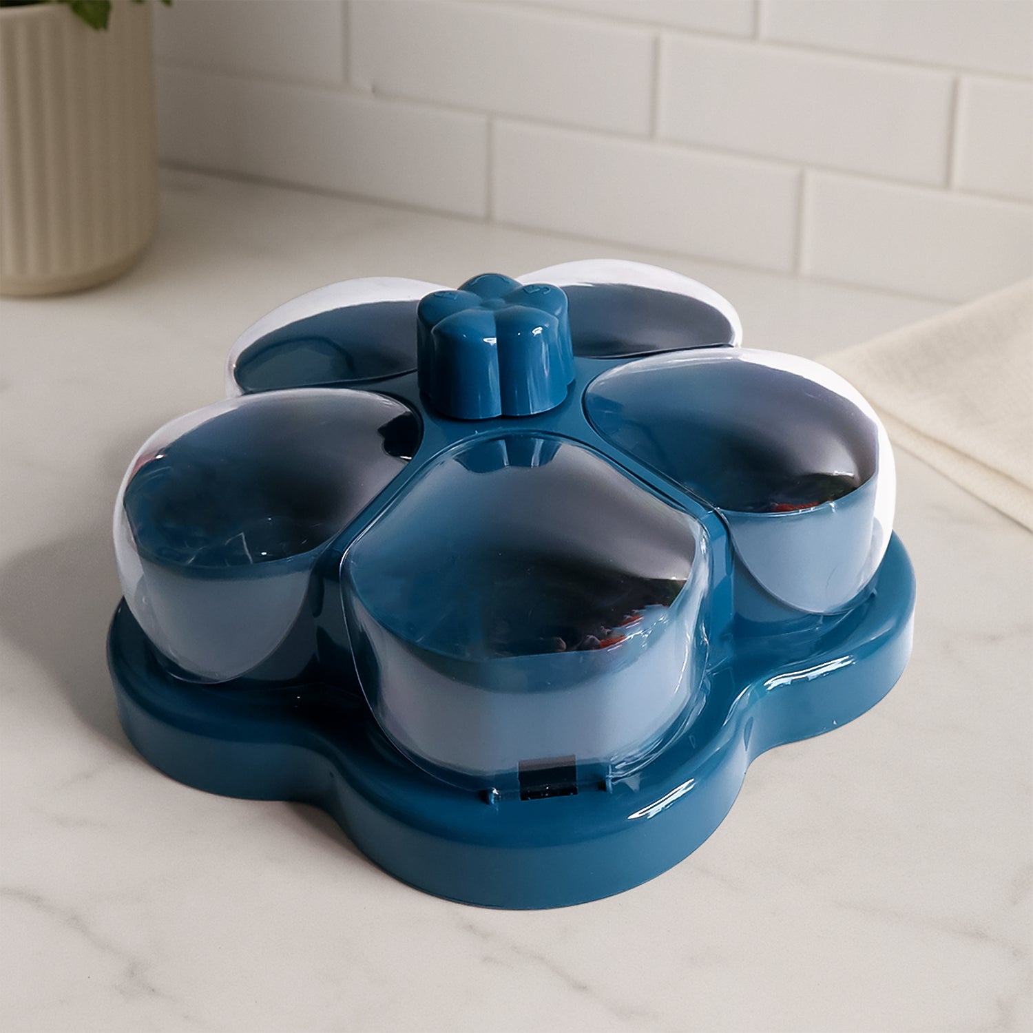 Wukusy lotus-shaped rotating dry fruit and snack organizer box with multiple compartments for home storage.