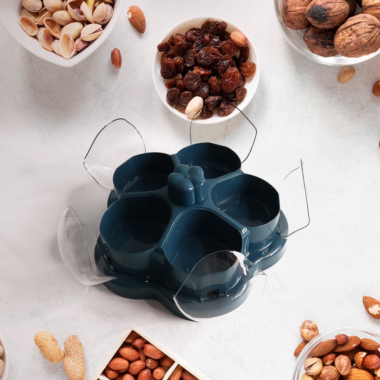 Wukusy lotus shape rotating dry fruit snack organizer box with multiple compartments, designed for home and kitchen storage.
