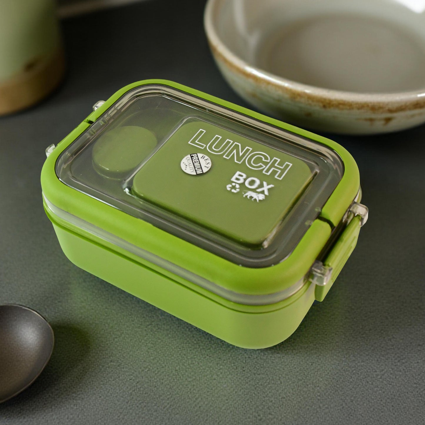 Wukusy Magic Lunch Box with leakproof compartments for easy, organized meal storage in a home and kitchen setting.