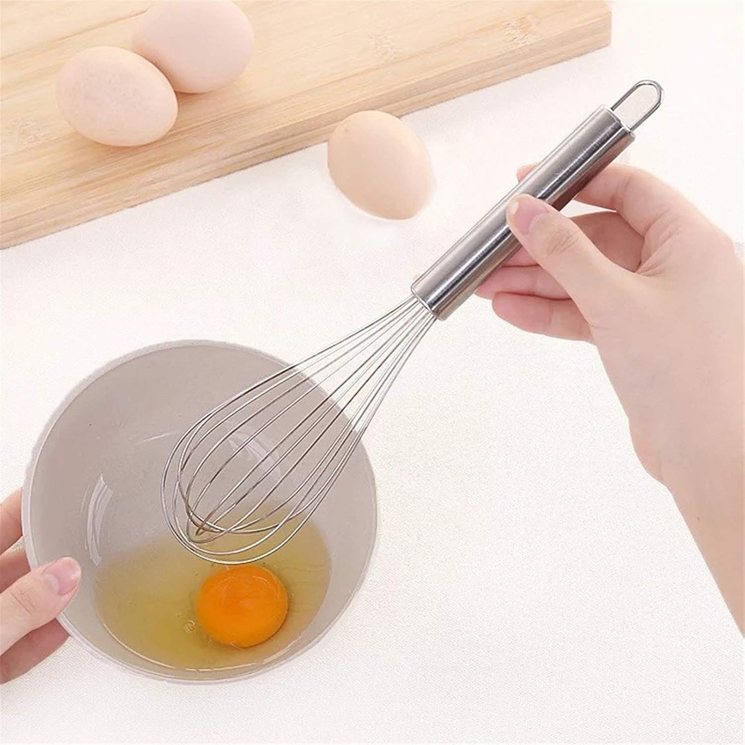 Medium stainless steel balloon whisk by Wukusy, 24cm, ideal for mixing and whipping in home and kitchen cooking tasks.