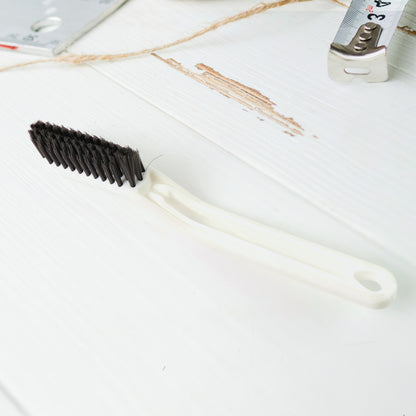 Wukusy 2-in-1 multifunctional floor gap cleaning brush for home and kitchen, designed for easy dirt removal from tight spaces.