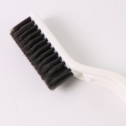 Wukusy 2-in-1 multifunctional floor gap cleaning brush for home and kitchen, with a compact design and durable bristles.