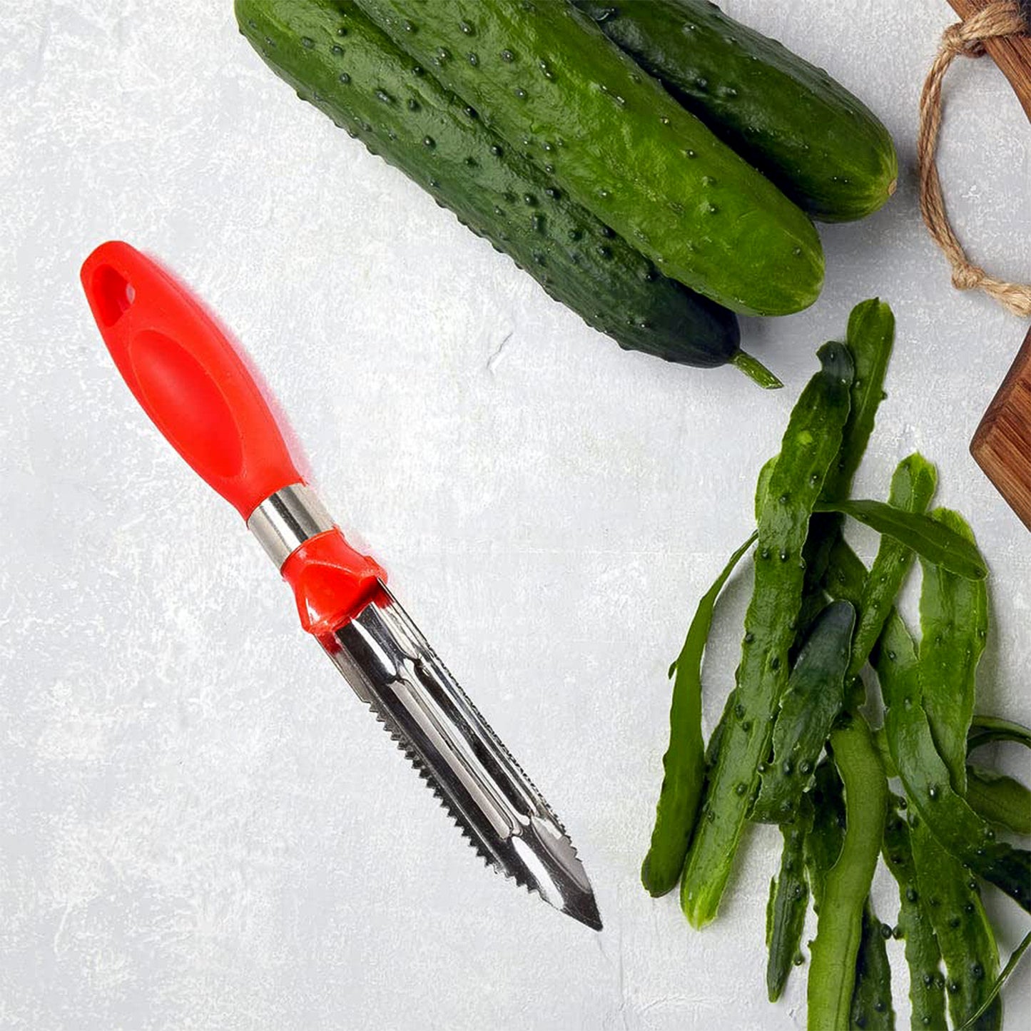 Wukusy 2-in-1 stainless steel knife peeler for versatile kitchen use, with a handle and peeling blade visible in the image.