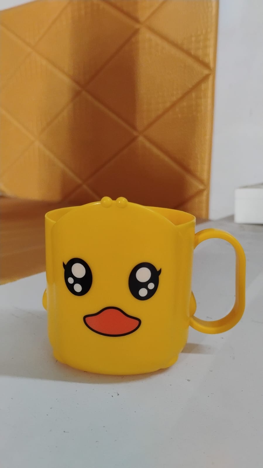 Wukusy cartoon plastic toothbrush cup for home use, featuring colorful cartoon design and a durable plastic construction.