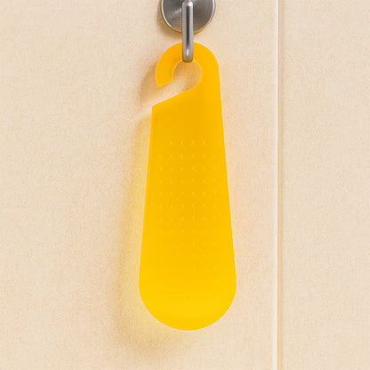 Wukusy multipurpose garlic and ginger grater peeler tool with hanging hook for kitchen prep, made of stainless steel and plastic.