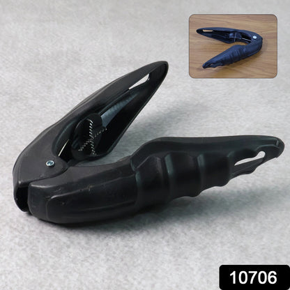 Wukusy multipurpose walnuts and seafood cracker tool for home kitchen use, showing the metal cracker in a countertop setting.