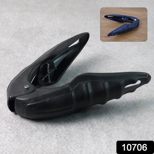 Wukusy multipurpose walnuts and seafood cracker tool for home kitchen use, showing the metal cracker in a countertop setting.