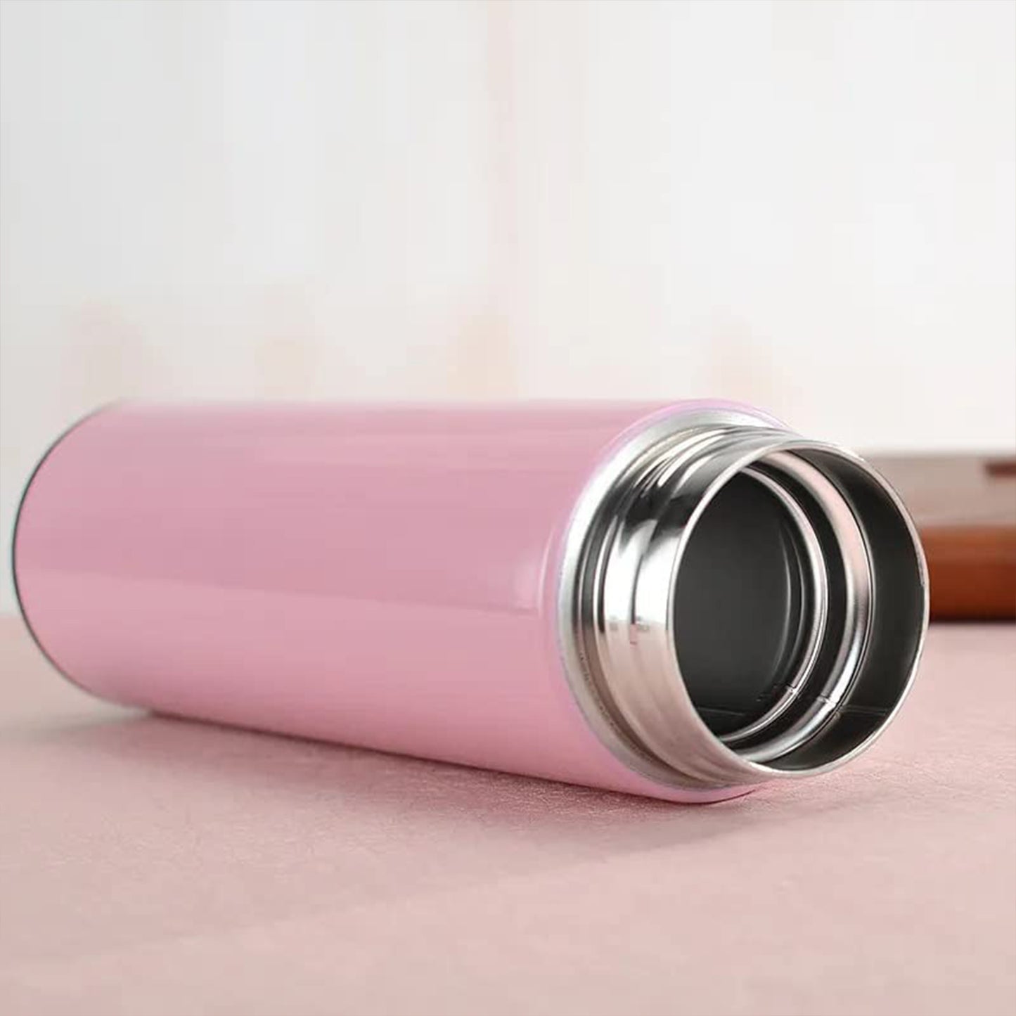 Pink Wukusy vacuum insulated water bottle, 500ml, with a sleek design for hot or cold beverages in home and kitchen use.