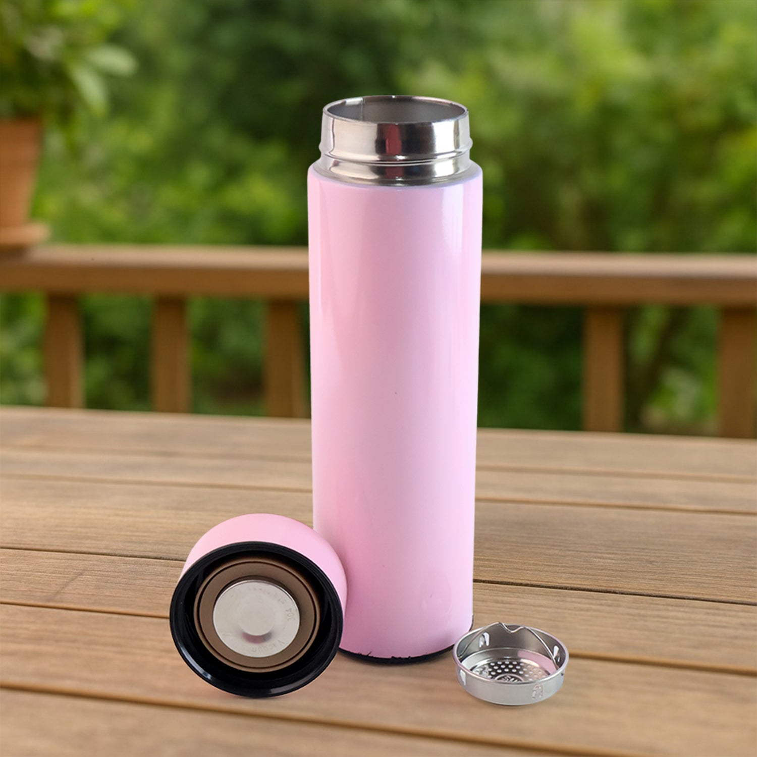 Pink Wukusy vacuum insulated water bottle, 500ml, for keeping beverages hot or cold, in a sleek home and kitchen style.