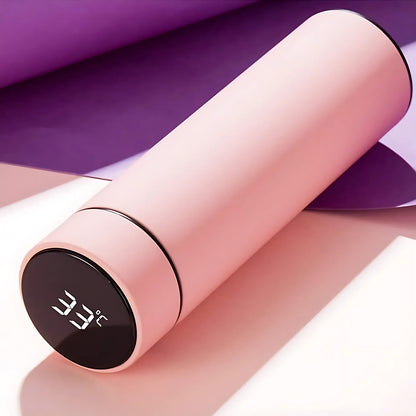 Pink Wukusy vacuum insulated water bottle, 500ml, for keeping drinks hot or cold, in a sleek, portable design.
