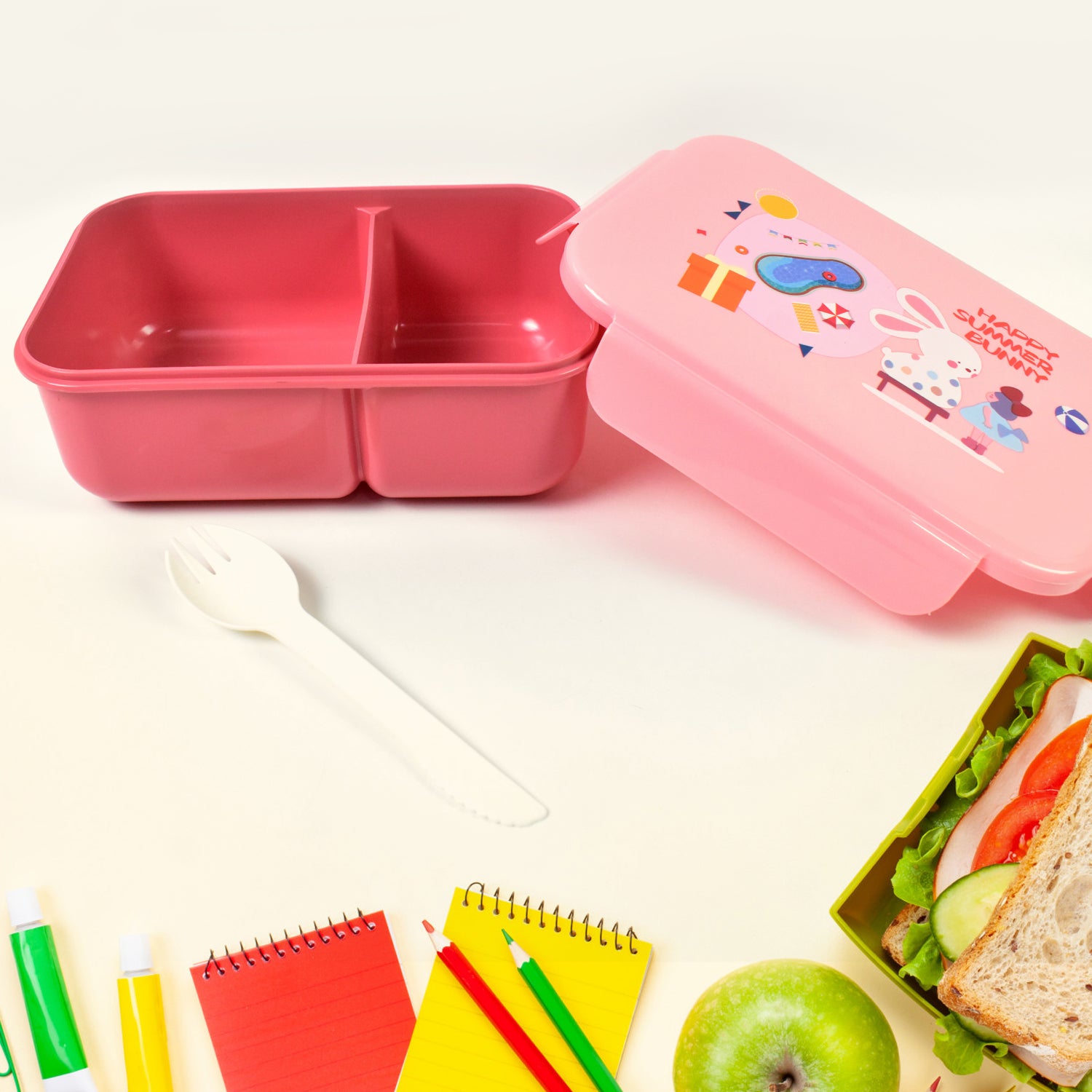 Colorful Wukusy plastic lunch box with two compartments, leak-proof design, bottle, and fork for home and kitchen use.