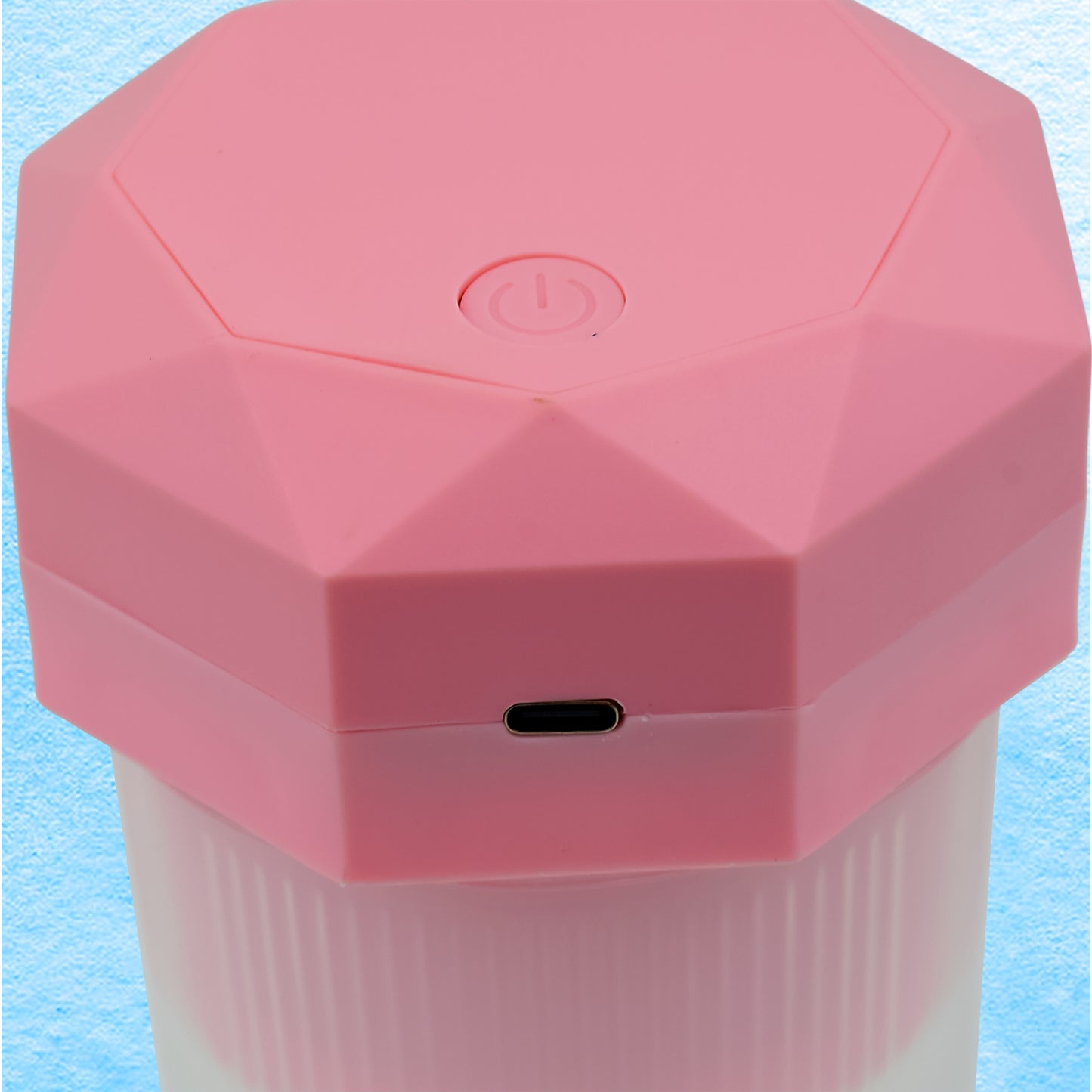 Wukusy portable electric juicer cup with 6 blades, 350ml capacity, compact design for making fresh juice at home or on the go.