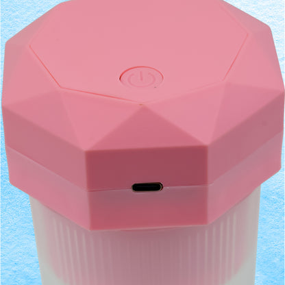 Wukusy portable electric juicer cup with 6 blades, 350ml capacity, compact design for making fresh juice at home or on the go.