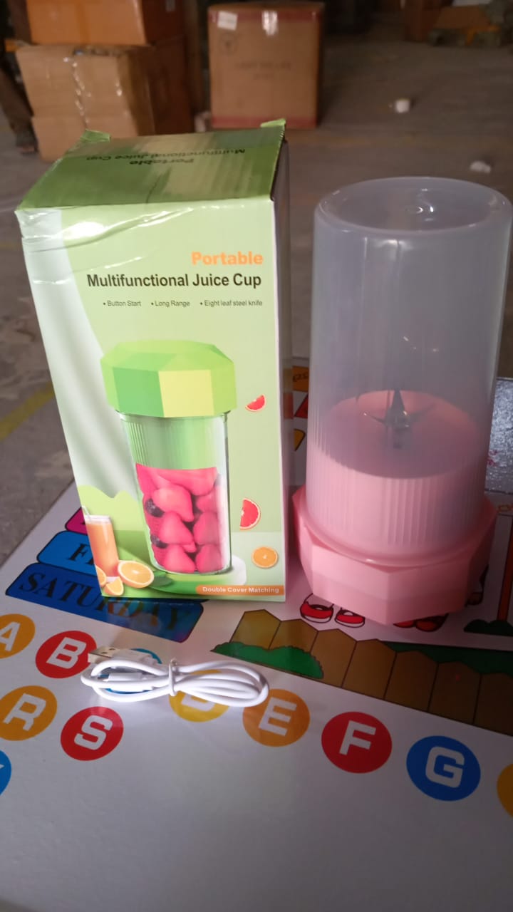 Wukusy portable electric juicer cup with 6 blades, 350ml capacity, ideal for making fresh juice on the go in a home or kitchen setting.