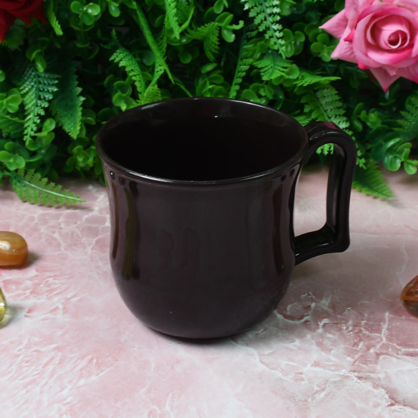 Black plastic coffee and tea mug with handle, premium lightweight design for home and kitchen use, by Wukusy.
