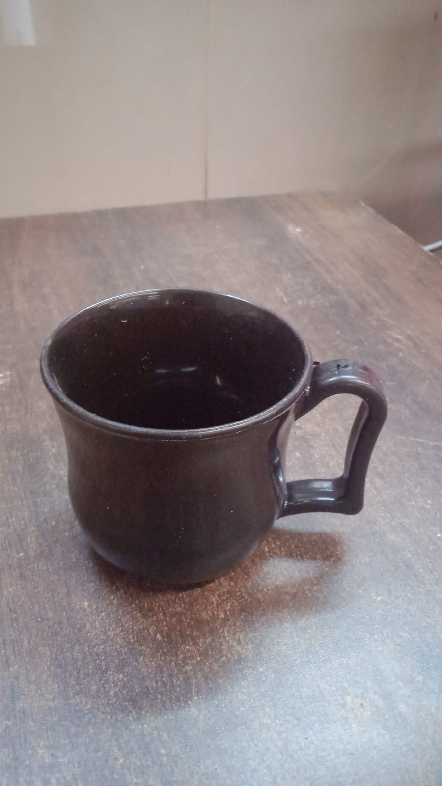 Black plastic coffee mug with handle, Wukusy premium tea cup for home use, 1 piece, lightweight and durable design.