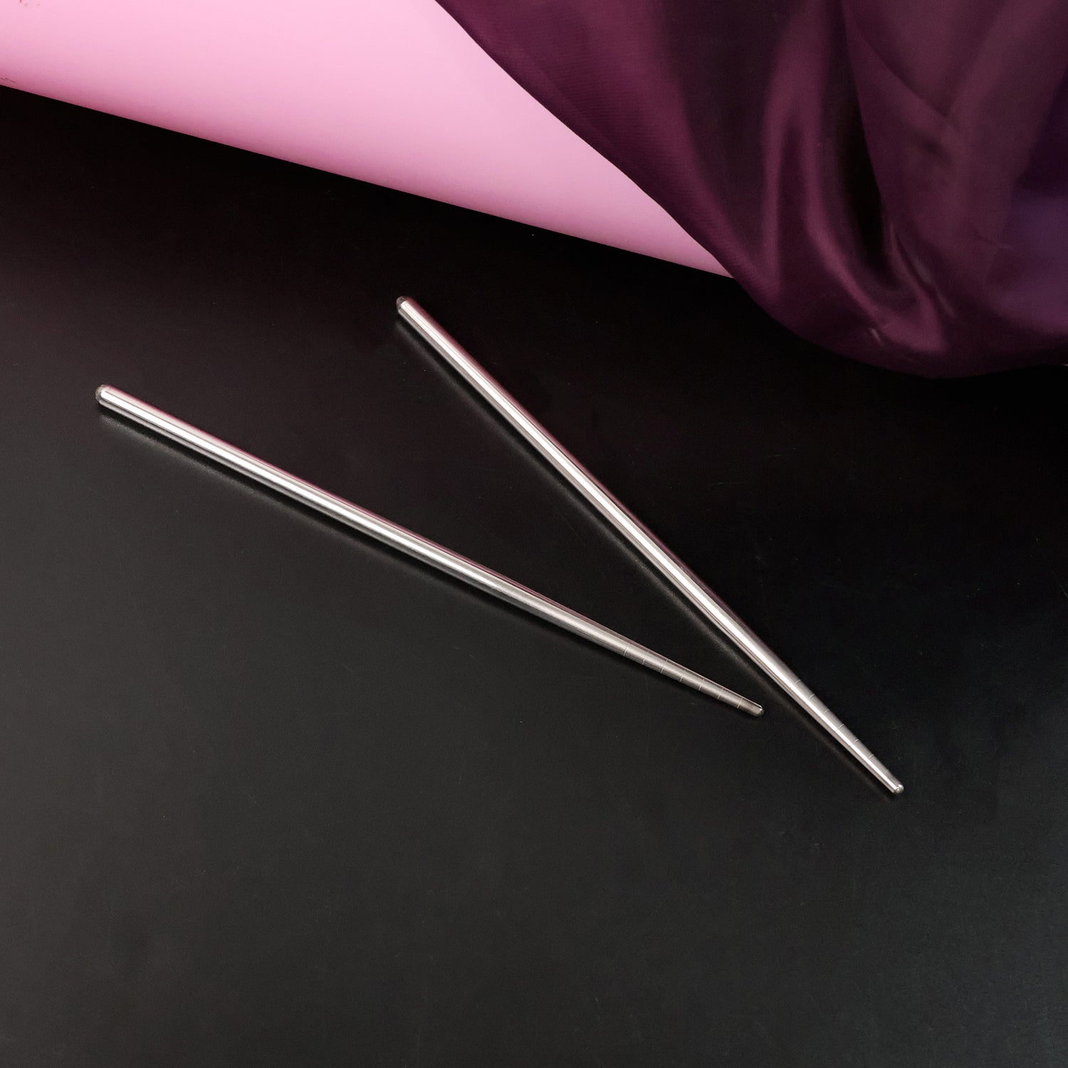 Pair of Wukusy premium stainless steel reusable chopsticks for home and kitchen use, featuring sleek, durable design.