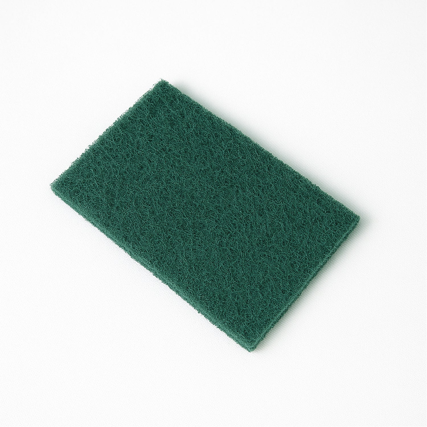 Wukusy heavy-duty kitchen scrubber pad, 4x6 inch, for cleaning pots, pans, and dishes in home and kitchen use.