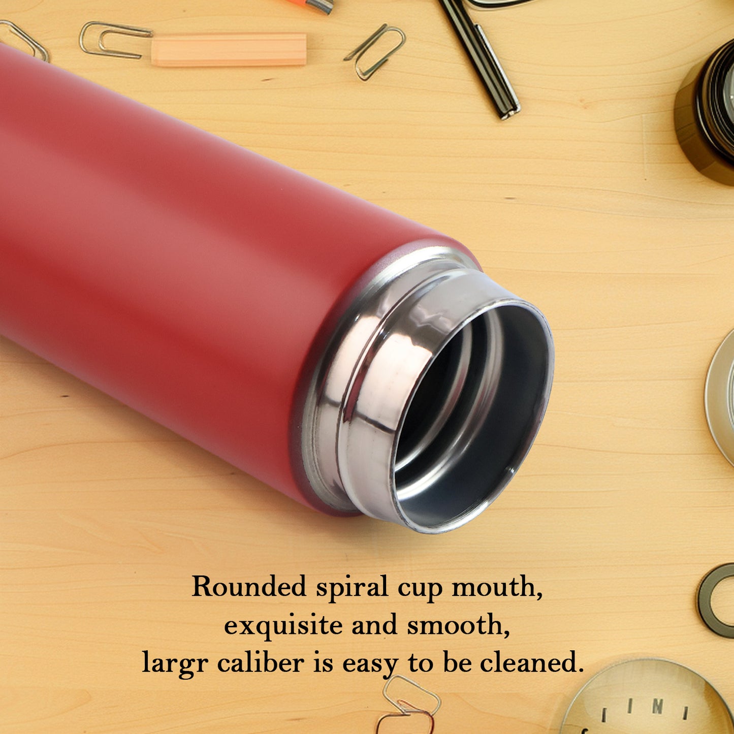 Red Wukusy vacuum insulated water bottle, 500ml, for keeping beverages hot or cold, shown in a home and kitchen setting
