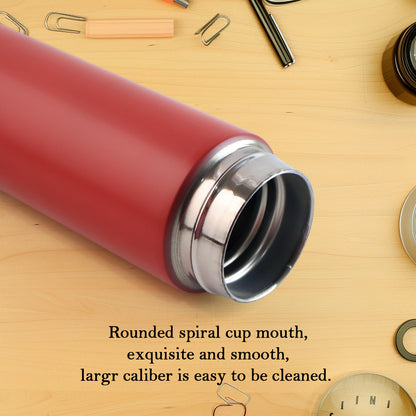 Red Wukusy vacuum insulated water bottle, 500ml, for keeping beverages hot or cold, shown in a home and kitchen setting