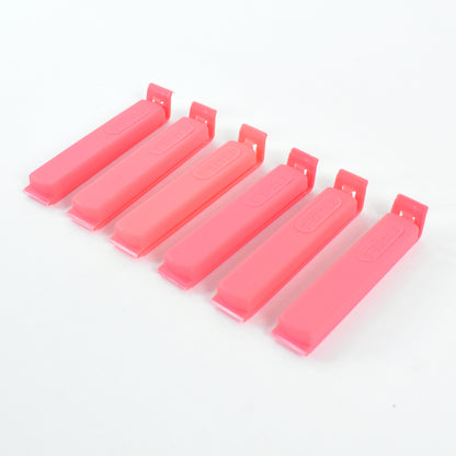 Wukusy Ritu 18-piece plastic pouch sealer clip set for sealing food storage bags in kitchen or home use.