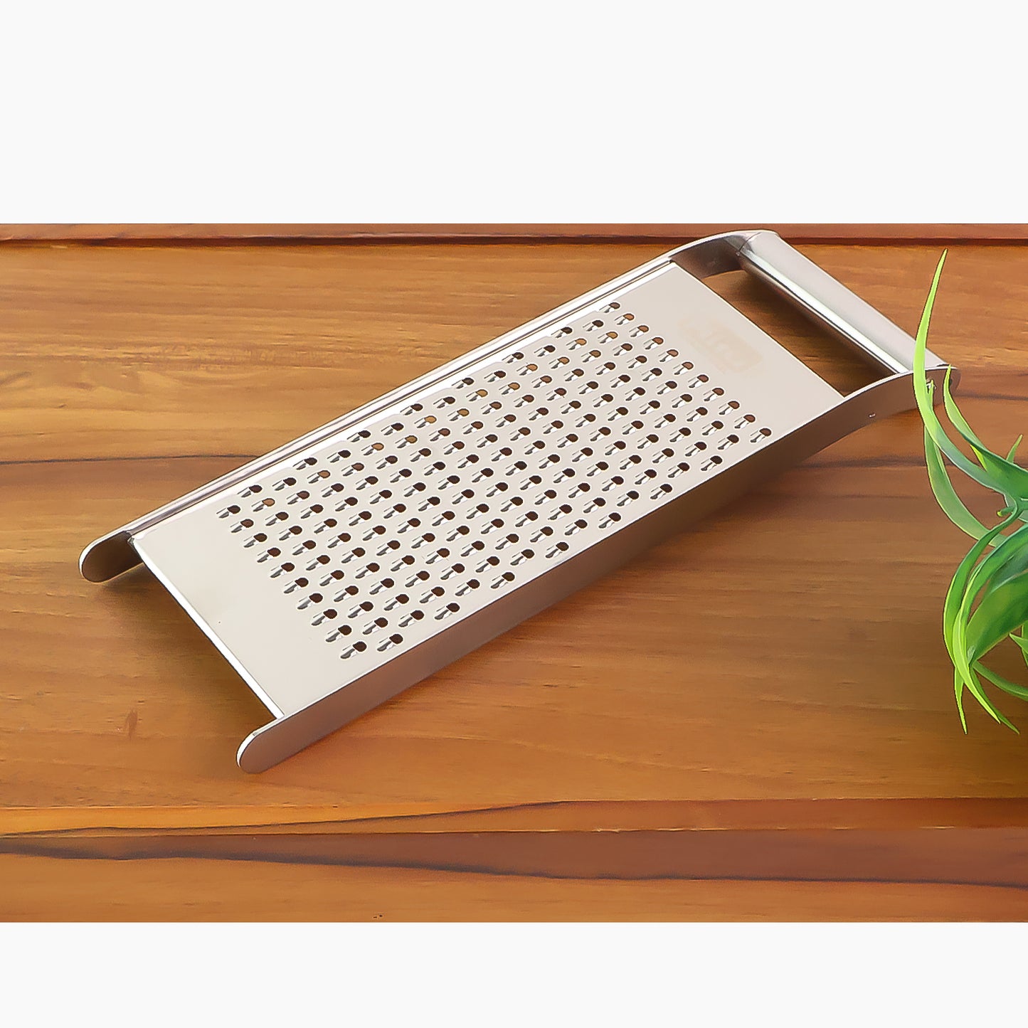Wukusy Ritu Premium Stainless Steel Handheld Grater and Slicer for kitchen use, featuring a compact design and ergonomic handle