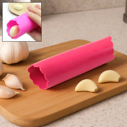 Wukusy silicone garlic peeler tube, easy hand roller peeling tool for garlic cloves in a home kitchen setting.