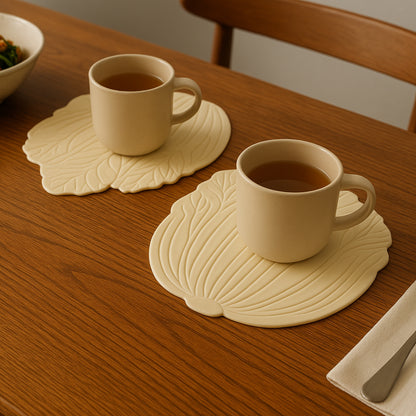 Silicone leaf design coaster set with two pieces, ideal for protecting surfaces in home and kitchen spaces, by Wukusy.