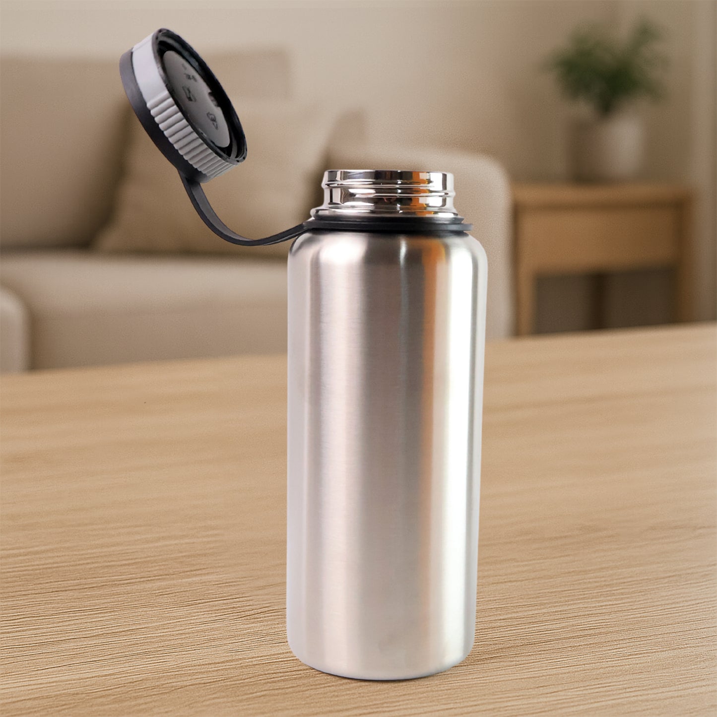 Silver stainless steel double wall vacuum-insulated water bottle by Wukusy, 1000 ml, ideal for keeping drinks hot or cold.