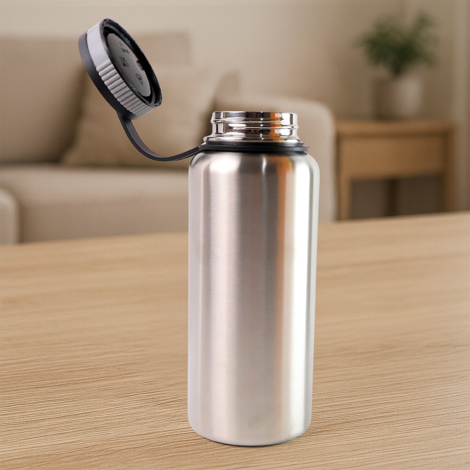 Silver stainless steel double wall vacuum-insulated water bottle by Wukusy, 1000 ml, ideal for keeping drinks hot or cold.