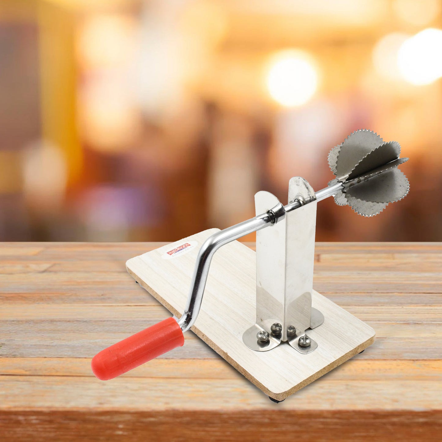 Stainless steel coconut scraper with wooden base by Wukusy, designed for easy coconut meat scraping in the kitchen.