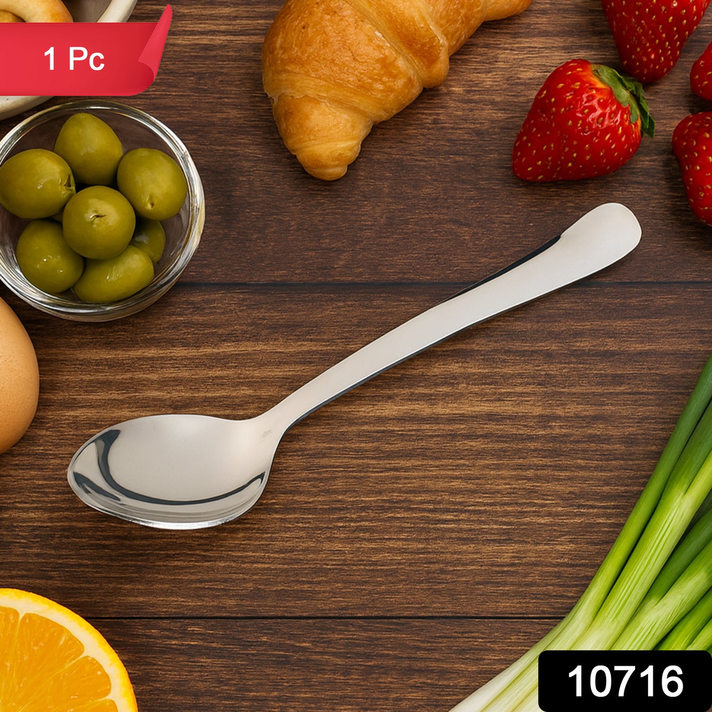 Stainless steel baby dining spoon by Wukusy, designed for infants, with a small ergonomic handle and rounded spoon bowl.