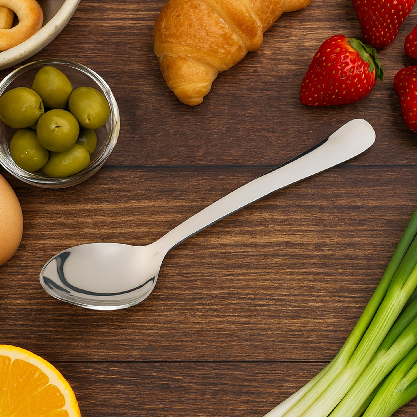 Wukusy stainless steel baby dining spoon with a smooth handle, designed for gentle feeding and easy handling.