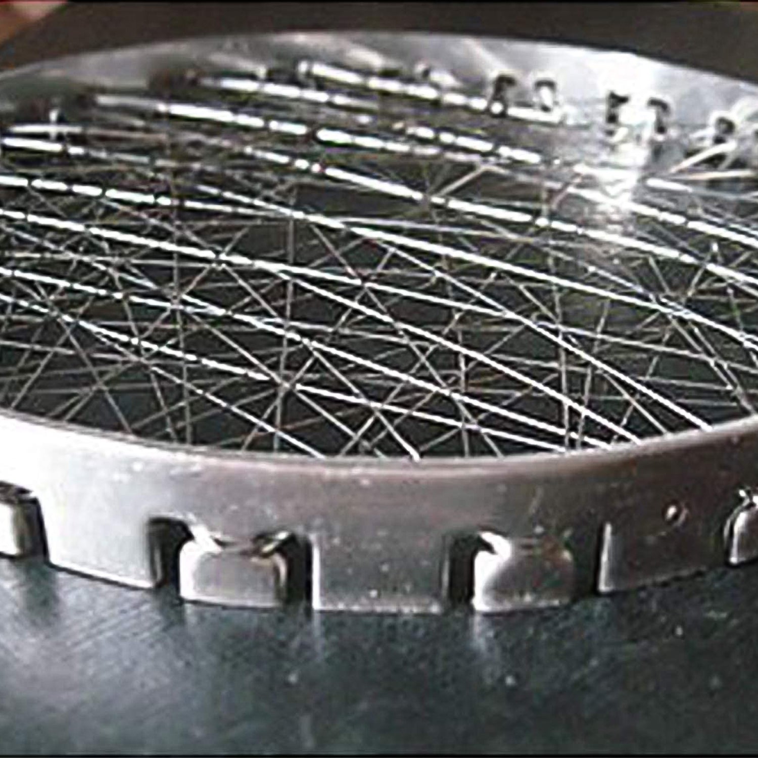 Stainless steel grill jalli chota tandoor by Wukusy, compact home kitchen tandoor with intricate grill pattern.