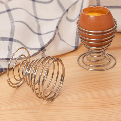 Stainless steel spring egg cup holder by Wukusy, designed for holding soft-boiled eggs in home and kitchen use.