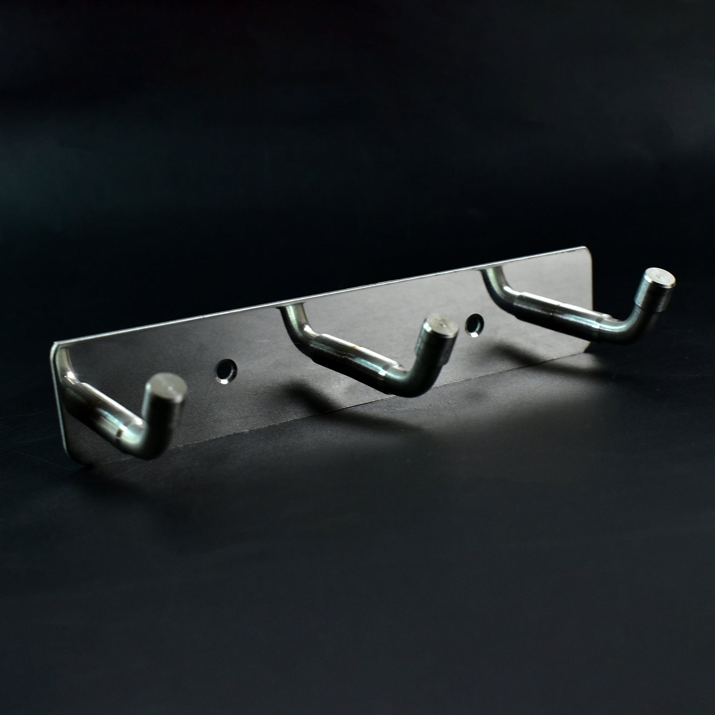 Stainless steel wall-mounted coat rack with three hooks, 14x3 inches, ideal for home and kitchen organization by Wukusy.