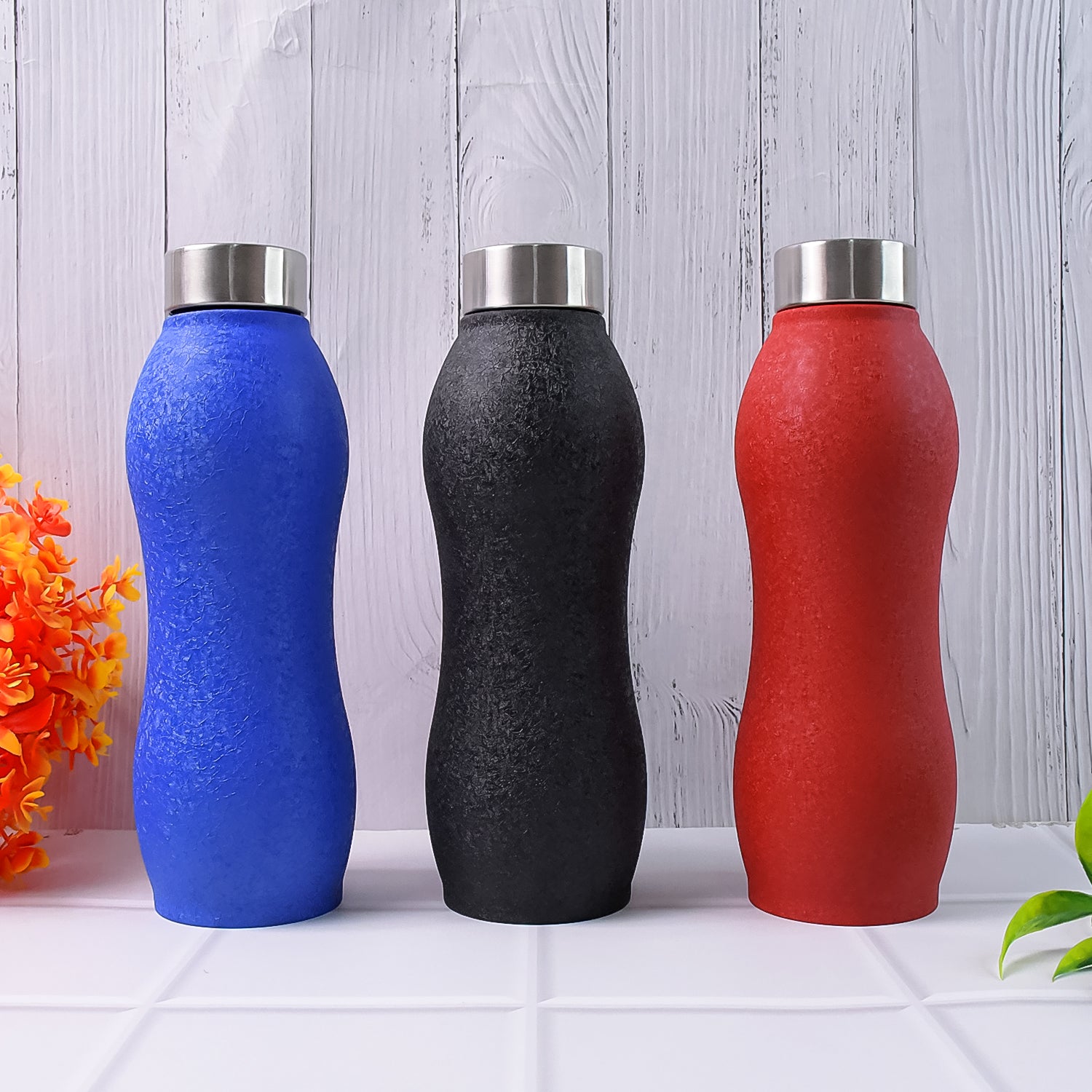 Wukusy stainless steel water bottle, 1000ml capacity, in mixed colors, featuring a crocodile design for home and kitchen use