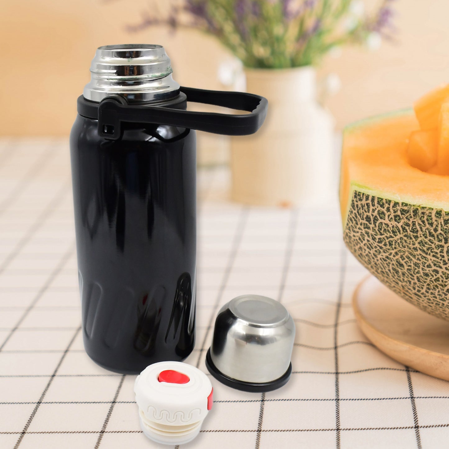 Stainless steel vacuum-insulated water bottle by Wukusy, 1200ml capacity, sleek design, ideal for keeping drinks hot or cold.