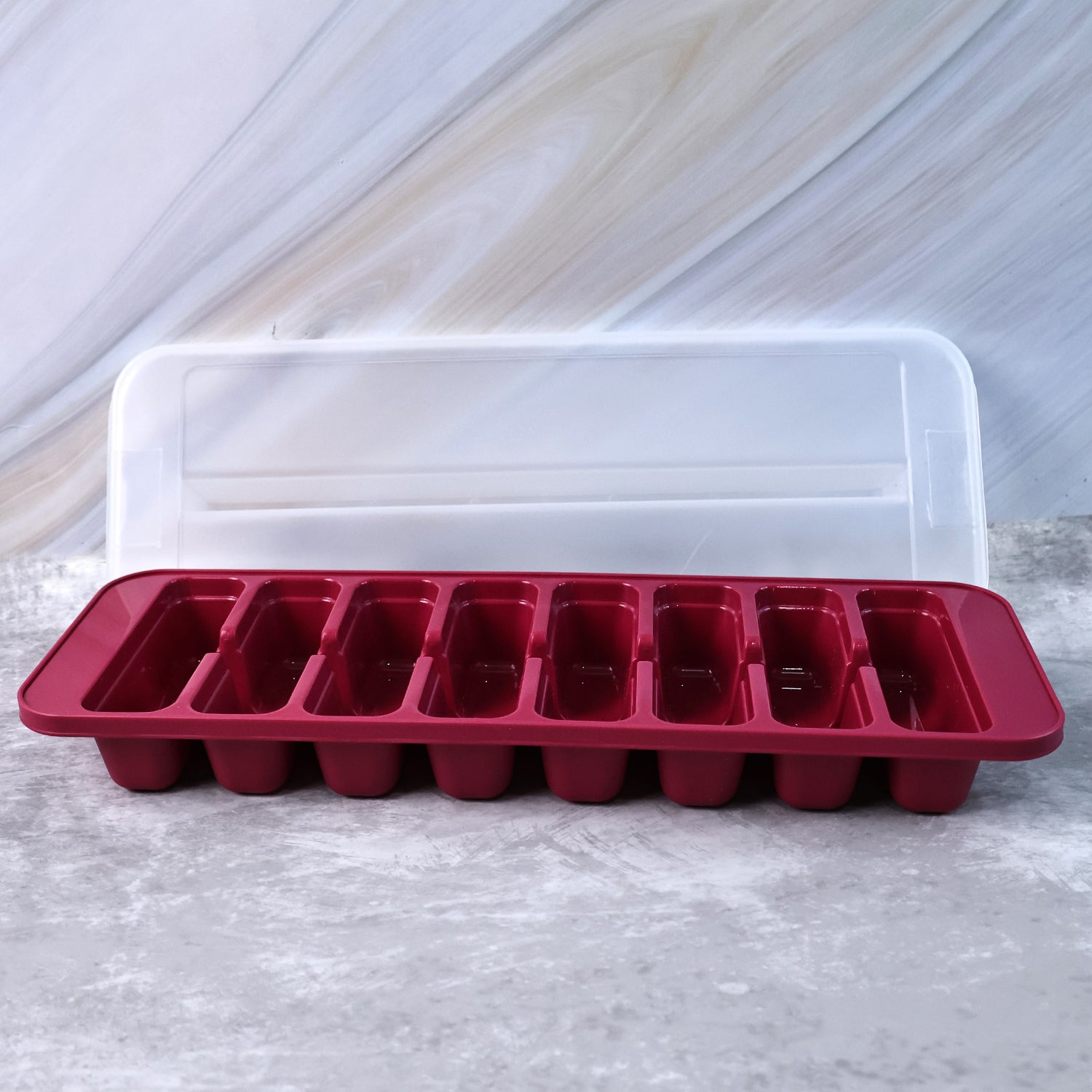Wukusy Supermom Frizzy Ice Tray with 2-in-1 compartment for ice cubes and storage box in a modern kitchen setting.
