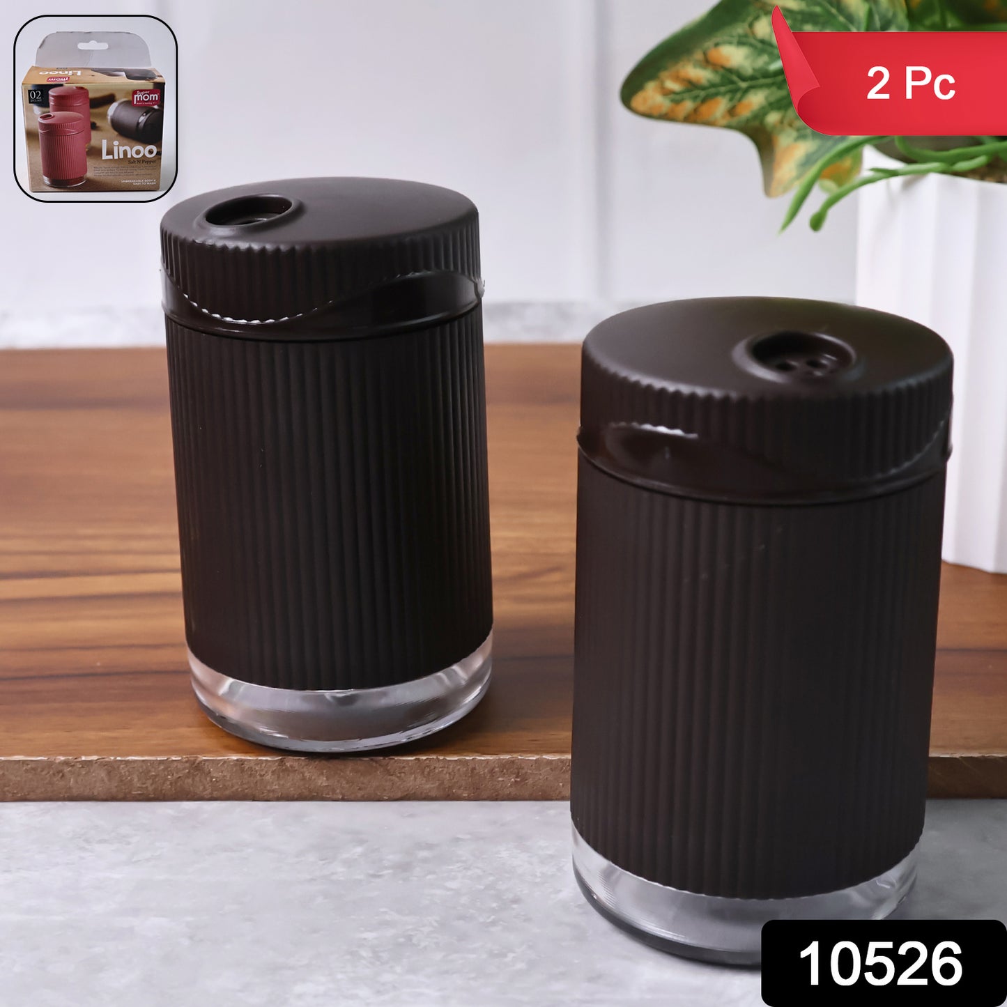 Wukusy Supermom Linoo salt and pepper dispenser set, 2-piece kitchen spice shakers with clear containers and black caps.