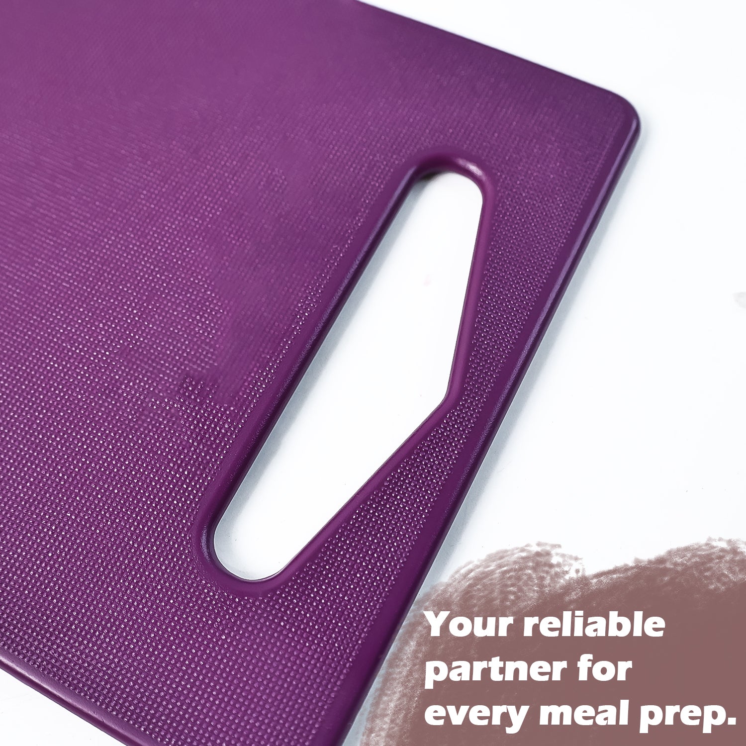 Wukusy Supermom Little Master unbreakable cutting board for kitchen use, durable and lightweight, shown on a clean countertop.