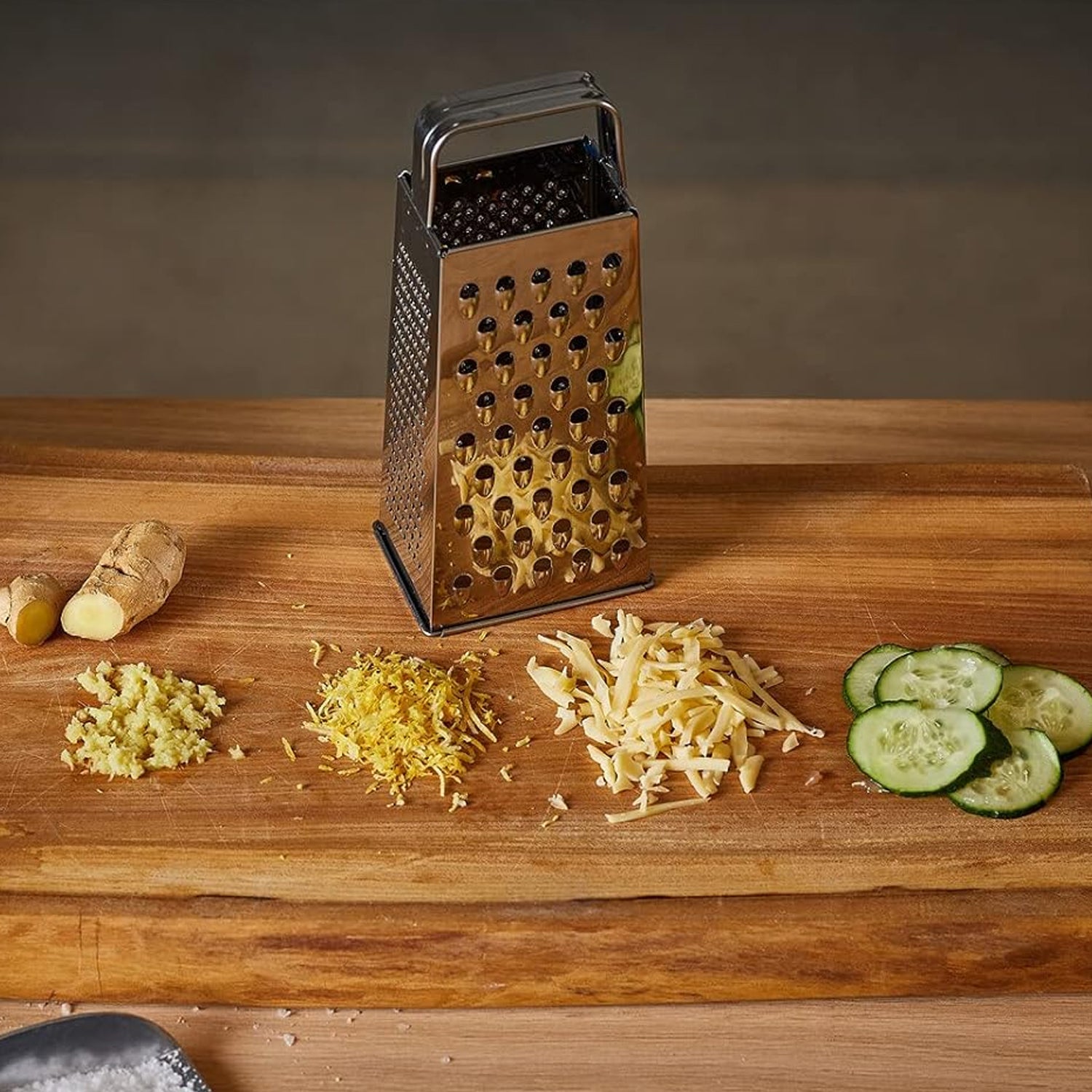 Wukusy Supermom Premium 5-in-1 stainless steel grater and slicer for versatile kitchen prep with multiple blades and handles.