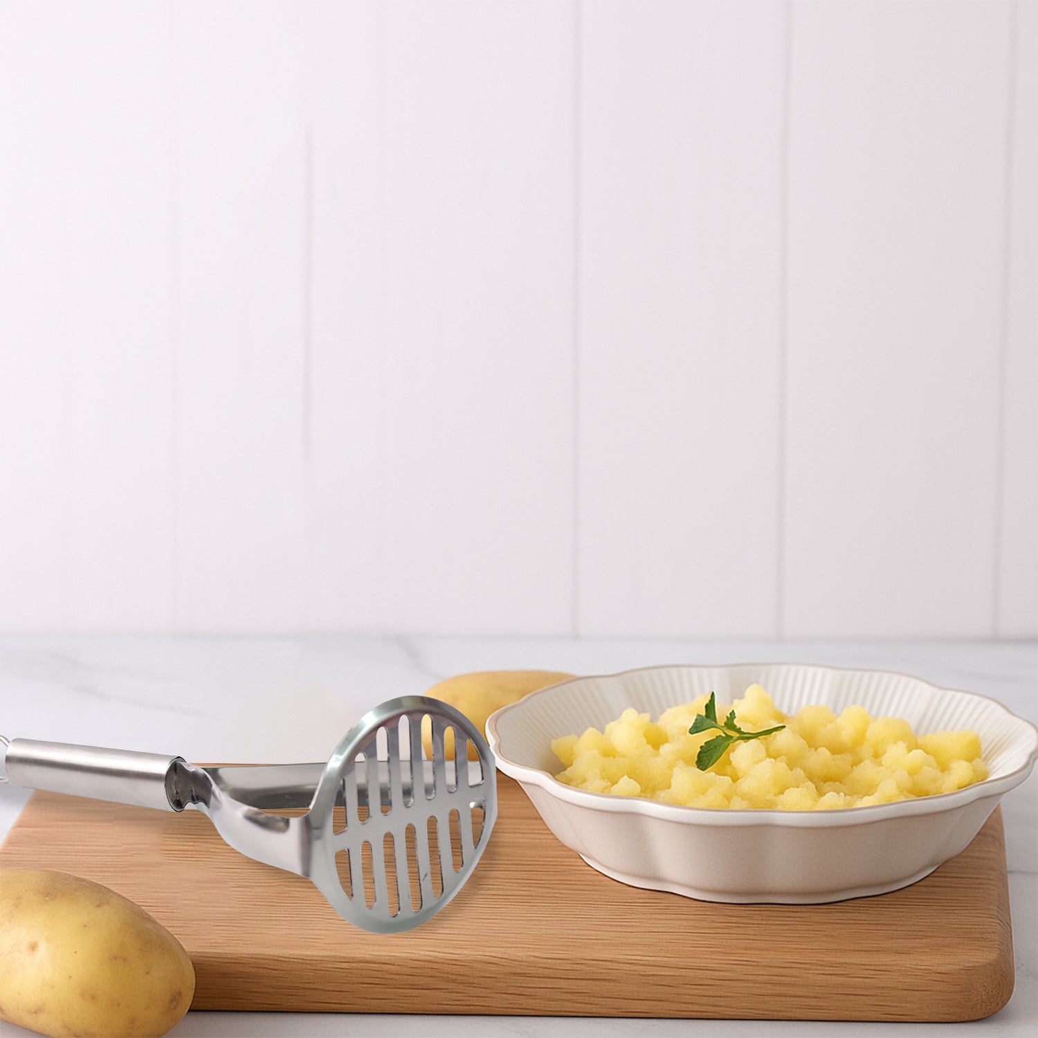 Supermom stainless steel potato masher with stylish handle, ideal for home kitchen use, by Wukusy.
