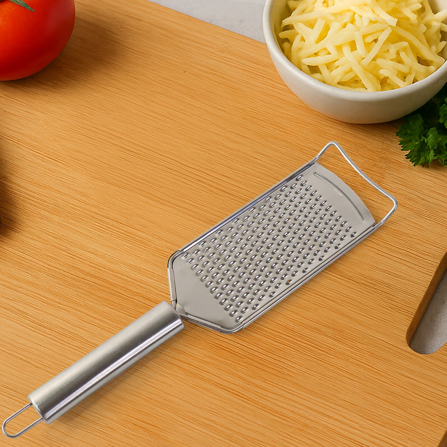 Wukusy Supermom stainless steel carrot grater for kitchen use, featuring a durable design for efficient vegetable grating.